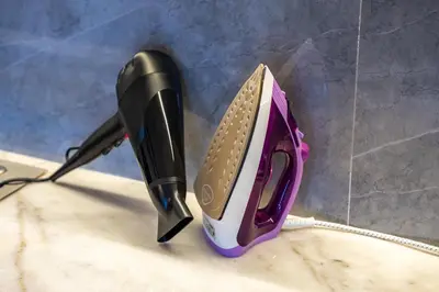 a black and purple iron sitting on top of a counter at LE MAJOREL Centre Marrakech in Marrakech