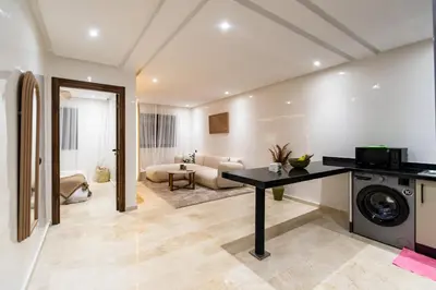 a living room with a washer and dryer at Modern Apartment in Victor Hugo Walk to Gueliz City Center in Marrakech