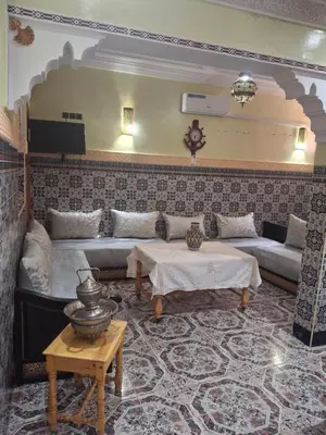 a living room with a couch and a table at Étoile de fatima - au cœur de la médina in Marrakech