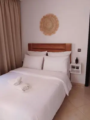 a bedroom with a bed with a towel on it at مراكش سنتر جيليز احسن موقع في مراكش in Marrakech