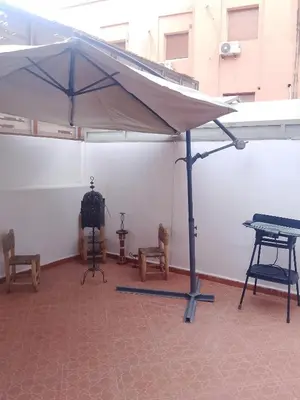 a tent with chairs and a table in a room at مراكش سنتر جيليز احسن موقع في مراكش in Marrakech