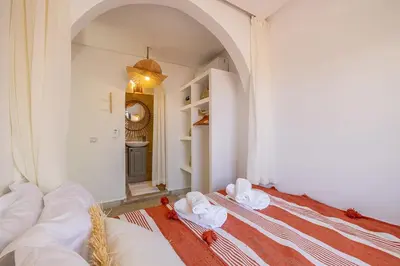 a room with a bed with towels on it at Riad Dar Mimouna -Exclusive&Brand new -Pool- 8pax in Marrakech