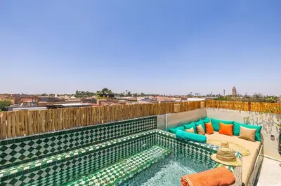 a swimming pool on the roof of a building at Riad Dar Mimouna -Exclusive&Brand new -Pool- 8pax in Marrakech