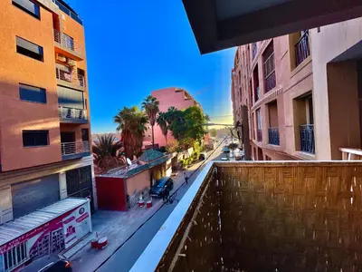 a view of a street from a balcony of a building at 5-Star Hidden Gem in Marrakech in Marrakech