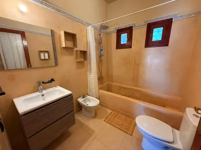 a bathroom with a sink and a toilet and a shower at DAR ENNAGA - Havre de paix, avec piscine chauffée , à 10 minutes de Marrakech in Marrakech