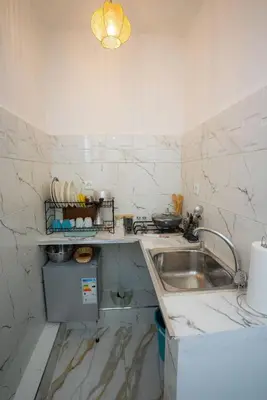 a kitchen with a sink and a counter top at Studio Blue Majorelle Marrakech in Marrakech