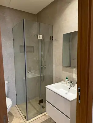 a bathroom with a shower and a sink and a toilet at Appartement Marrakech in Marrakech