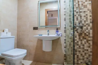 a bathroom with a toilet and a sink and a shower at Gueliz Train Station - Swimming Pool - Cosy in Marrakech