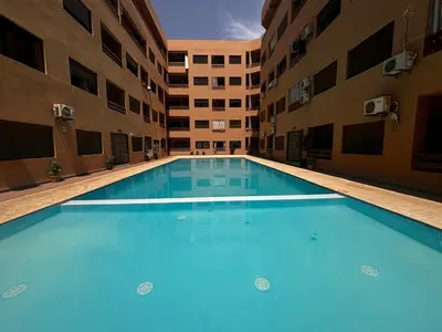 an empty swimming pool in an apartment building at Gueliz Train Station - Swimming Pool - Cosy in Marrakech