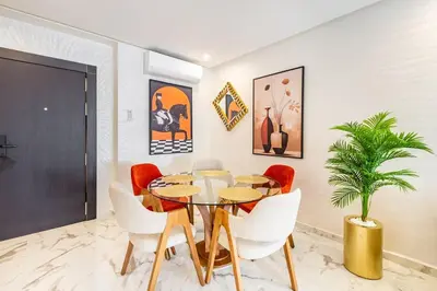 a dining room with a table and chairs at Luxury House avec Piscine et Terrasse in Marrakech