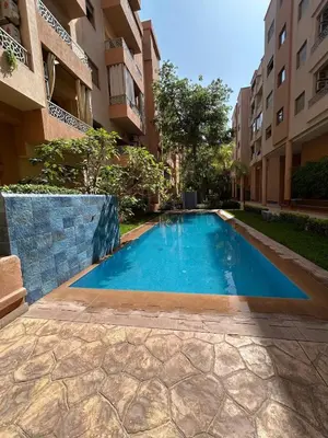 a swimming pool in the middle of a building at Appartement Haut Standing in Marrakech