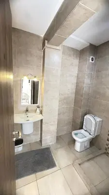 a bathroom with a toilet and a sink at Lovely apartment N15 in Marrakech