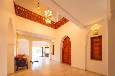 a hallway of a home with a chandelier at Villa Jnan Targa Pool & Garden in Marrakech