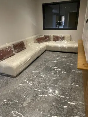 a white couch sitting in a living room at The YY collection apartments in Marrakech