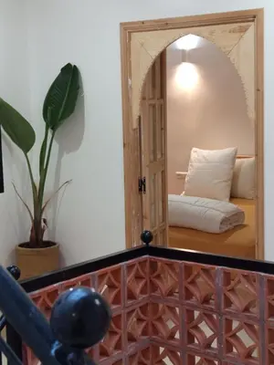 a room with a mirror and a bed in a room at Minka Marishan exclusif Riad in Royal destrict in Marrakech
