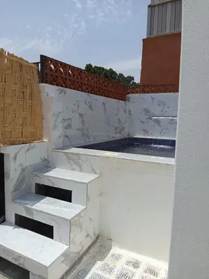 a balcony with white stairs on a building at Minka Marishan exclusif Riad in Royal destrict in Marrakech