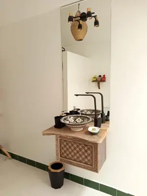 a bathroom with a sink and a mirror at Minka Marishan exclusif Riad in Royal destrict in Marrakech