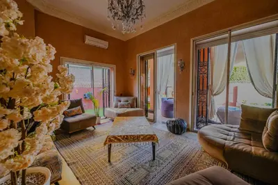 a living room with a couch and a table at Riad dar Nafaa in Marrakech