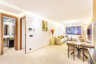 a living room with a couch and a table at Central Gueliz 1-bedroom apartment in Marrakech