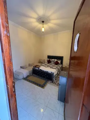 a room with two beds in a room at Dar El Bahja à 5 minutes de la place Jemaa el-Fna in Marrakech