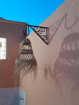 a bird feeder hanging from the side of a building at Dar El Bahja à 5 minutes de la place Jemaa el-Fna in Marrakech