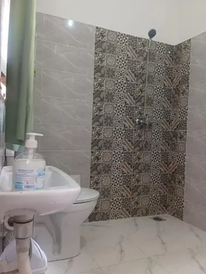 a bathroom with a toilet and a sink and a shower at Dar El Bahja à 5 minutes de la place Jemaa el-Fna in Marrakech