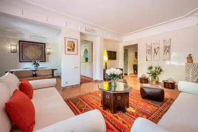 a living room with a couch and a table at Chez fatina in Marrakech
