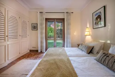 a bedroom with a large bed and a window at Chez fatina in Marrakech