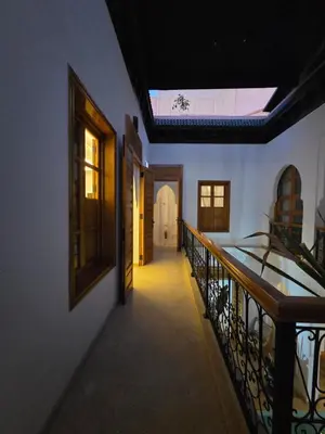 a hallway of a house with a skylight at Riad Amanar in Marrakech