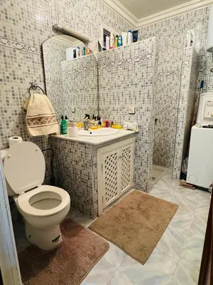 a bathroom with a toilet and a sink at Cozy room in marrakech in Marrakech