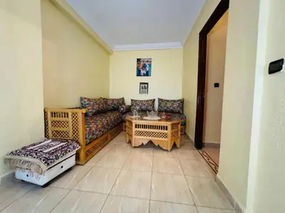 a living room with a couch and a table at Cozy room in marrakech in Marrakech
