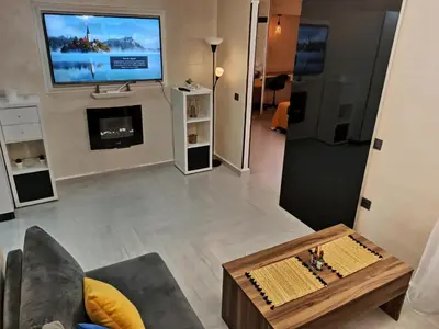 a living room with a tv and a coffee table at Splendid One Bedroom center of Marrakech -Gueliz- in Marrakech