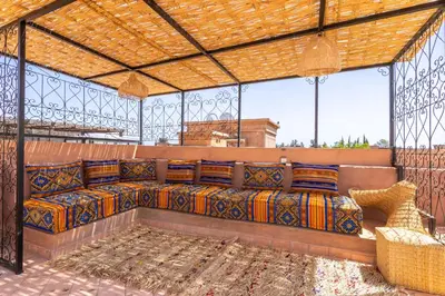 a large couch in a gazebo with windows at Villa riad raffinée privée à Marrakech in Marrakech