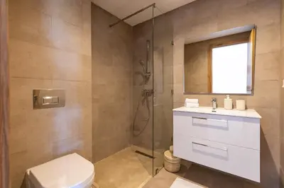 a bathroom with a shower and a toilet and a sink at Élégance et confort 3 chambre sur le golf de Noria in Marrakech