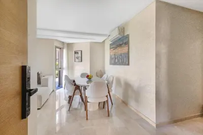 a dining room with a table and chairs at Nice apartment in Marrakesh in Marrakech
