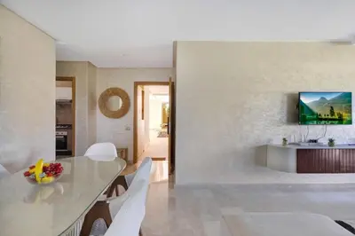 a kitchen and dining room with a table and chairs at Nice apartment in Marrakesh in Marrakech
