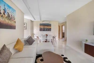 a living room with a couch and a table at Nice apartment in Marrakesh in Marrakech