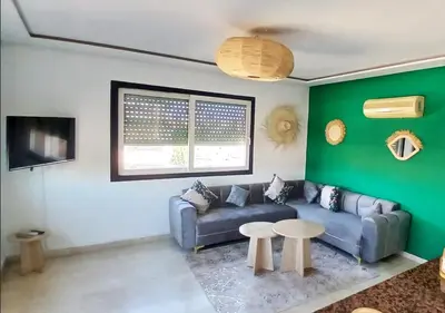 a living room with a couch and a table at Séjour Arty et Confort à Marrakech in Marrakech