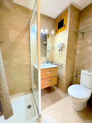 a bathroom with a shower and a toilet and a sink at Pause rêvée au cœur de Marrakech in Marrakech
