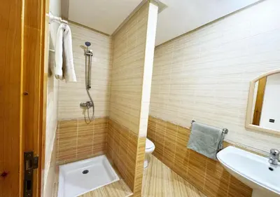 a bathroom with a toilet and a sink at Escapade citadine avec balcon et confort total in Marrakech