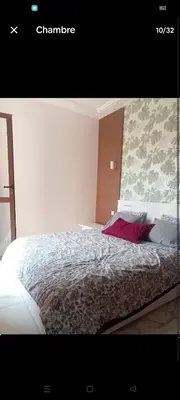 a bedroom with a bed in a room at Appartement cosy moderne luxe in Marrakech