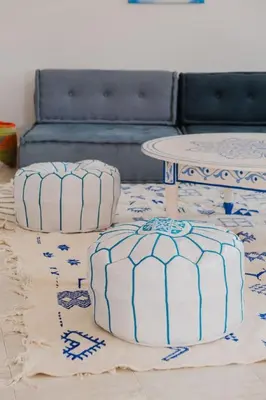two cakes sitting on a rug in a living room at Very comfortable villa in the heart of Marrakech in Marrakech