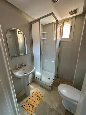 a bathroom with a shower and a sink and a toilet at L'AUTHENTIQUE 37 face de la gare CTM Hivernage in Marrakech