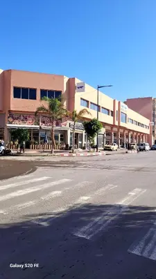an empty street in front of a large building at L'AUTHENTIQUE 37 face de la gare CTM Hivernage in Marrakech