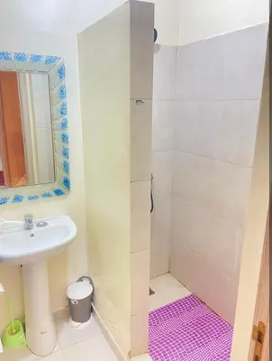 a bathroom with a sink and a shower at Moroccorent in Marrakech