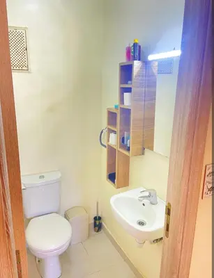 a bathroom with a toilet and a sink at Moroccorent in Marrakech
