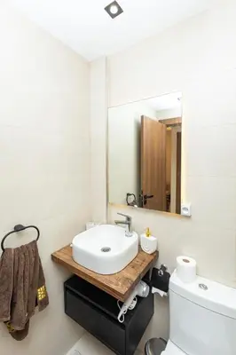 a bathroom with a sink and a mirror at Elegance and Comfort in Marrakesh in Marrakech