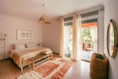 a bedroom with a bed and a large window at Cozy apartment Marrakech hivernage with nice terrace in Marrakech
