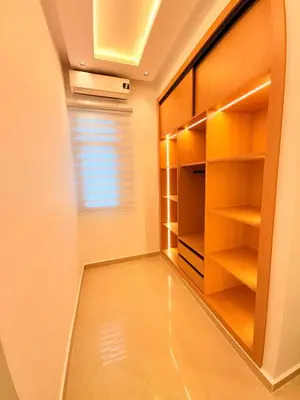 a room with a walk in closet with a window at Villa privée in Marrakech