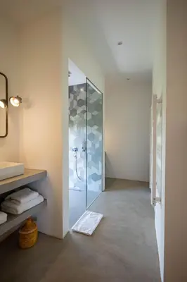 a bathroom with a glass shower with a sink at Charmante villa de 4CH avec piscine privée - Proche du Beldi Country Club in Marrakech